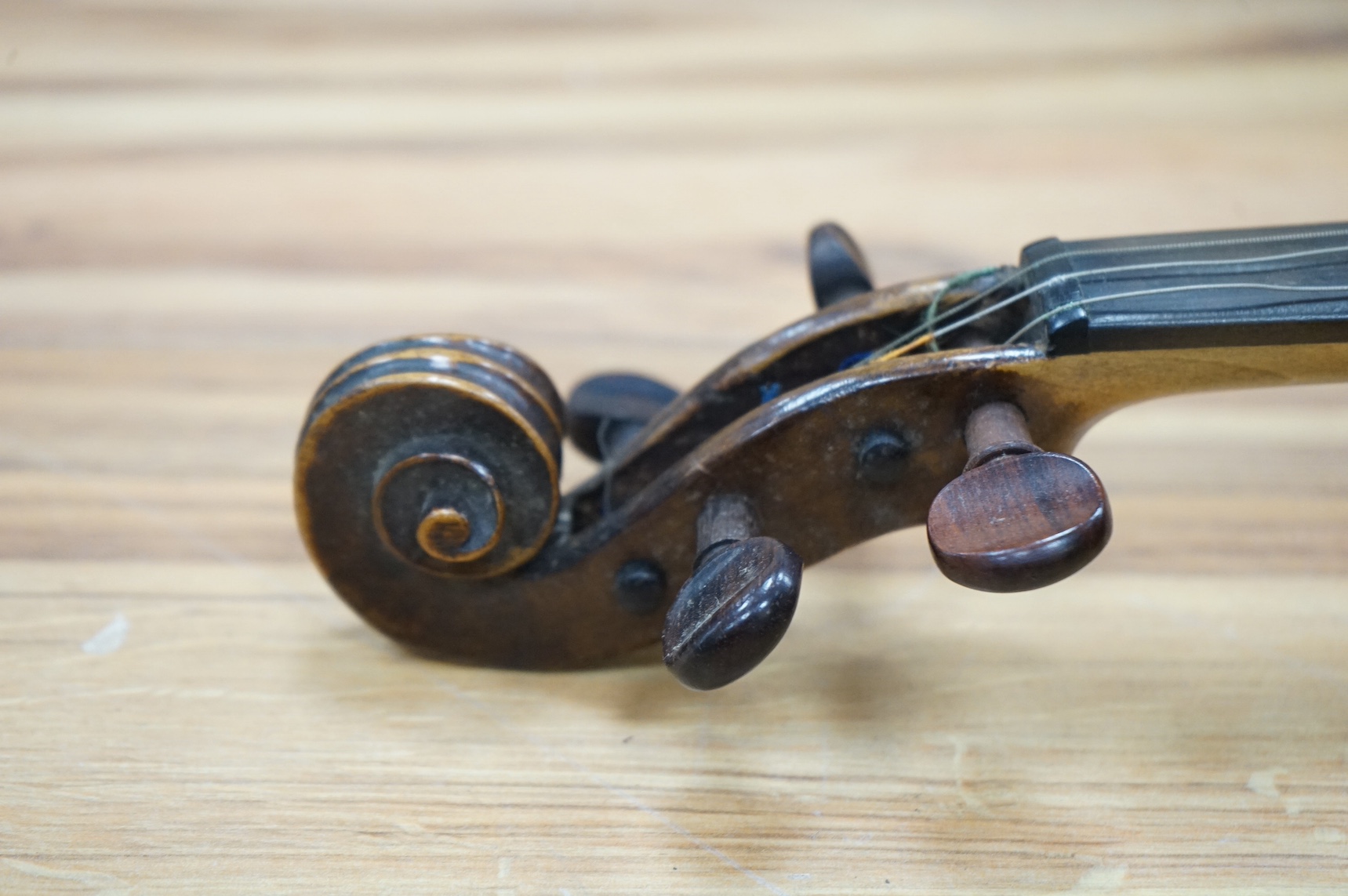 A cased 19th century French violin, back, 36cm. Condition - fair